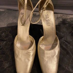 Women’s gold Gucci heels